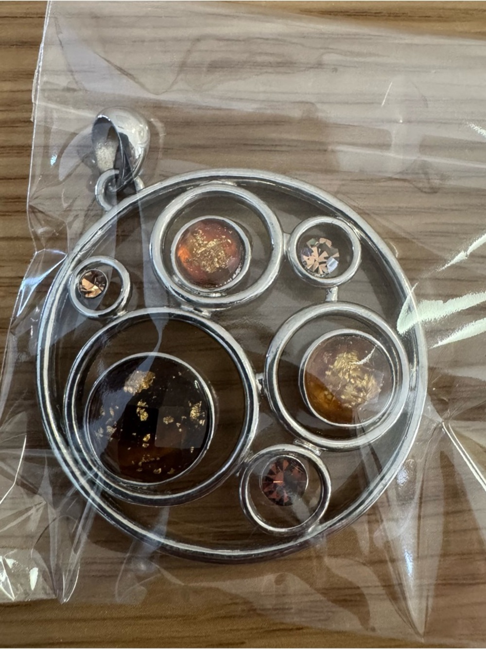 Silver Circular Pendant Necklace with Amber Accents